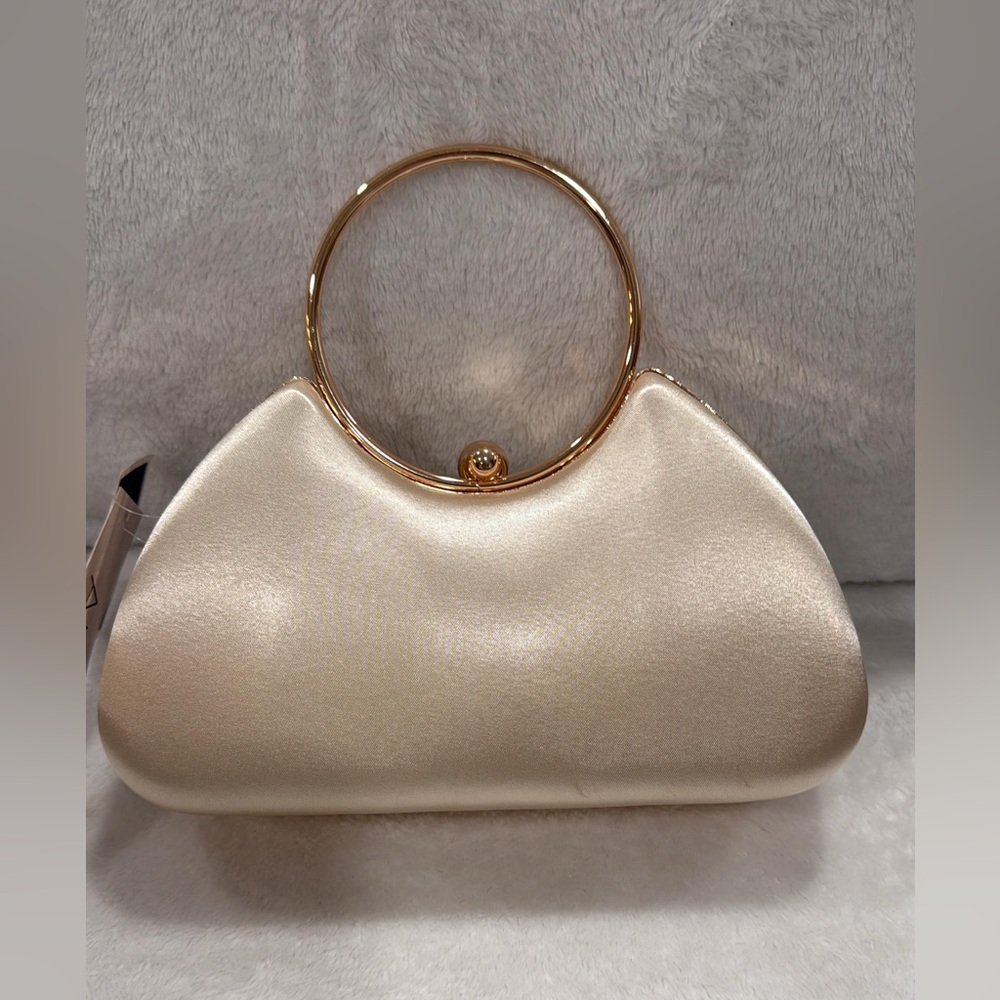 Elegant Cream Handbag with Gold Accents